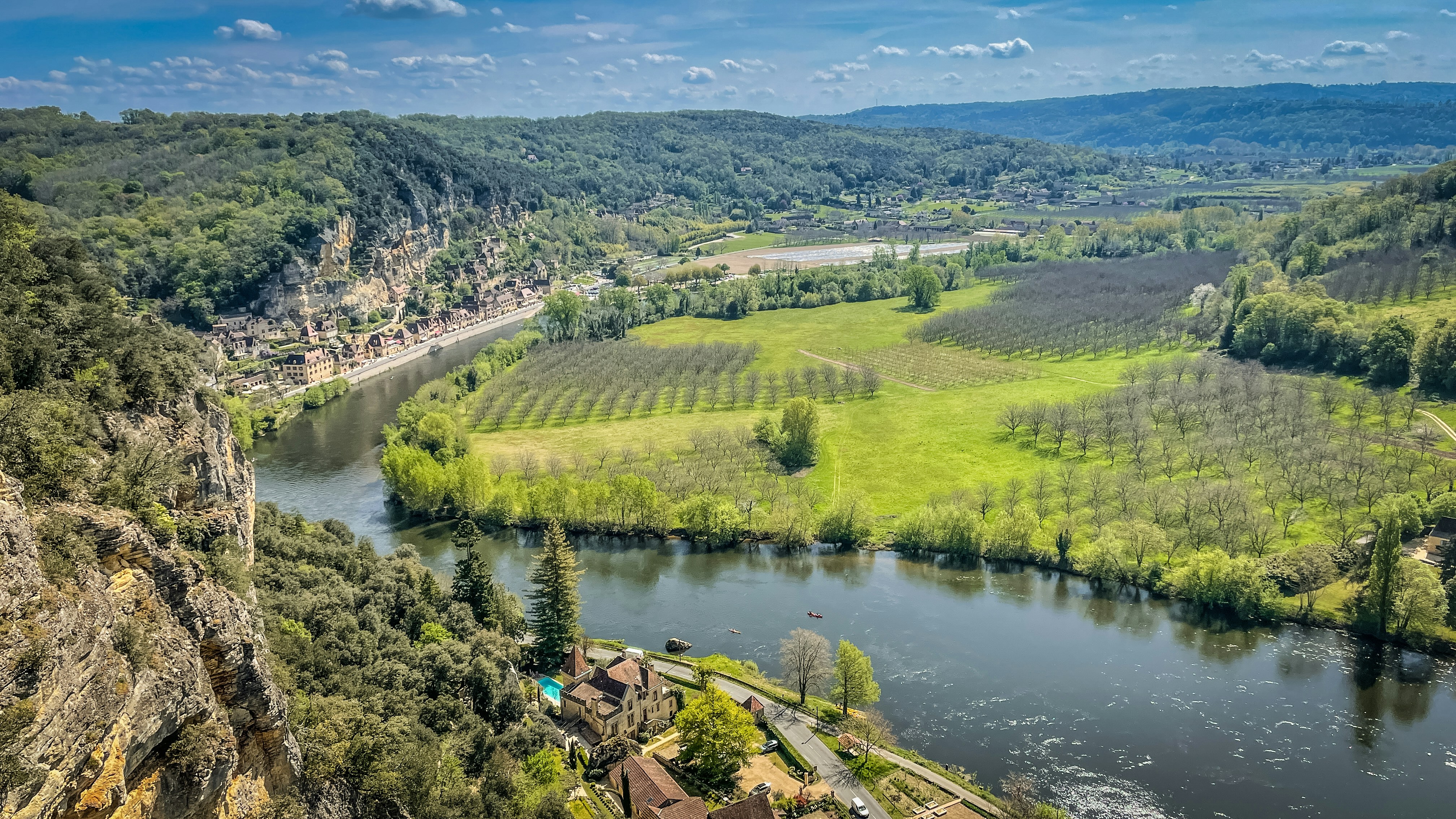 a river running through a lush green valley