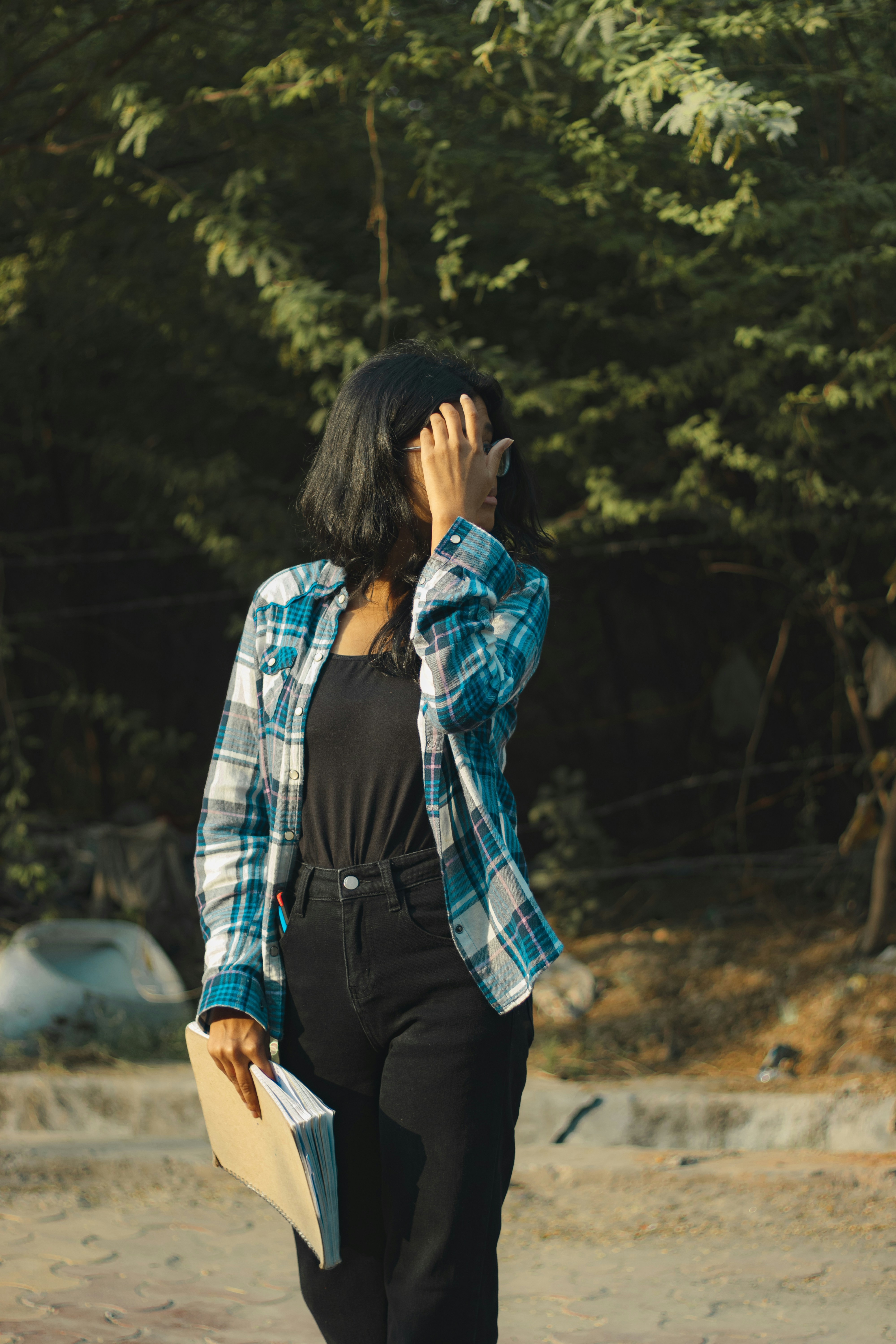 a woman walking while talking on a cell phone