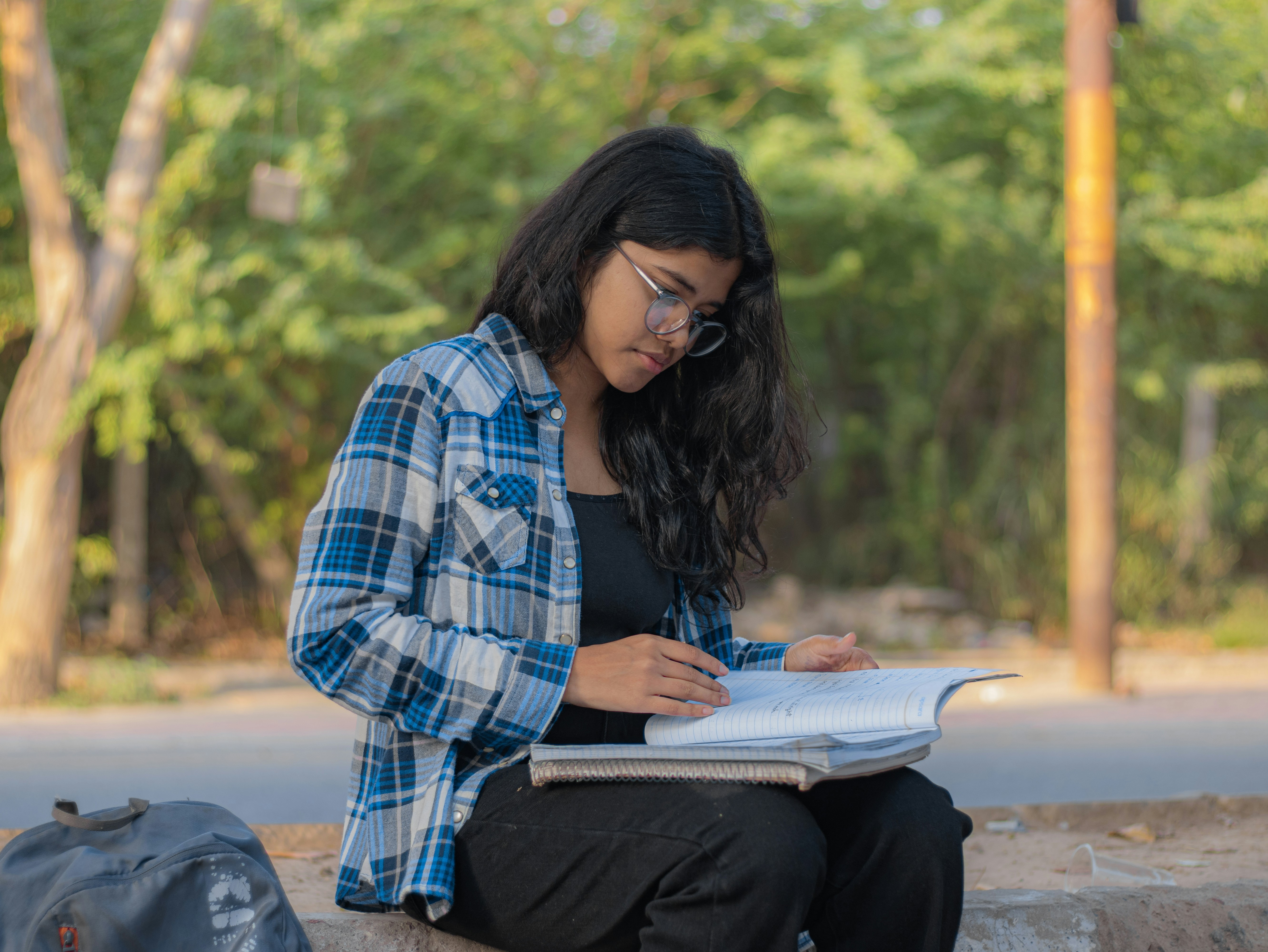 Teen journaling or practicing mindfulness outdoors. Alt: resilience training for teens - resilience training for teens