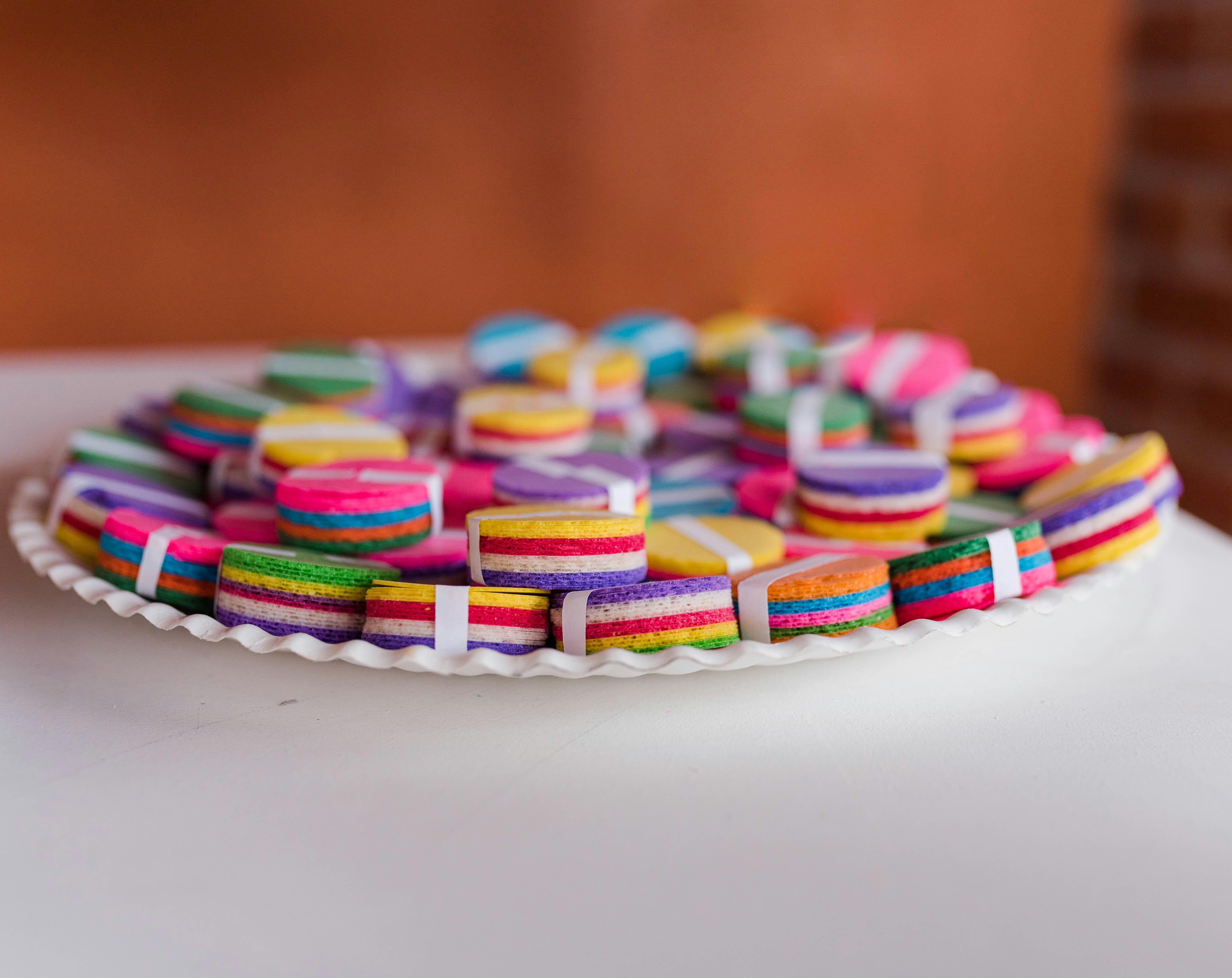 a plate of colorfully decorated cookies on a table