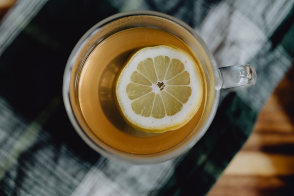 A cup of tea with a slice of lemon