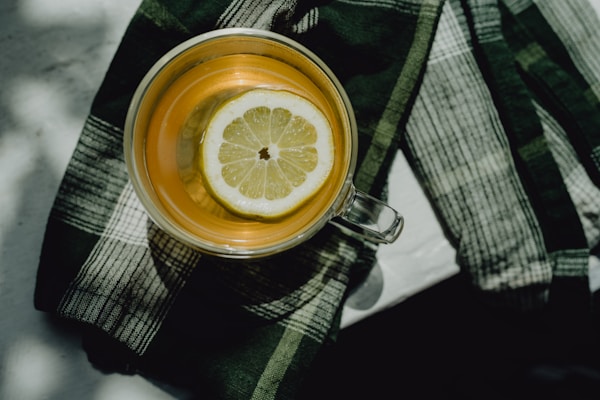 A cup of tea with a slice of lemon