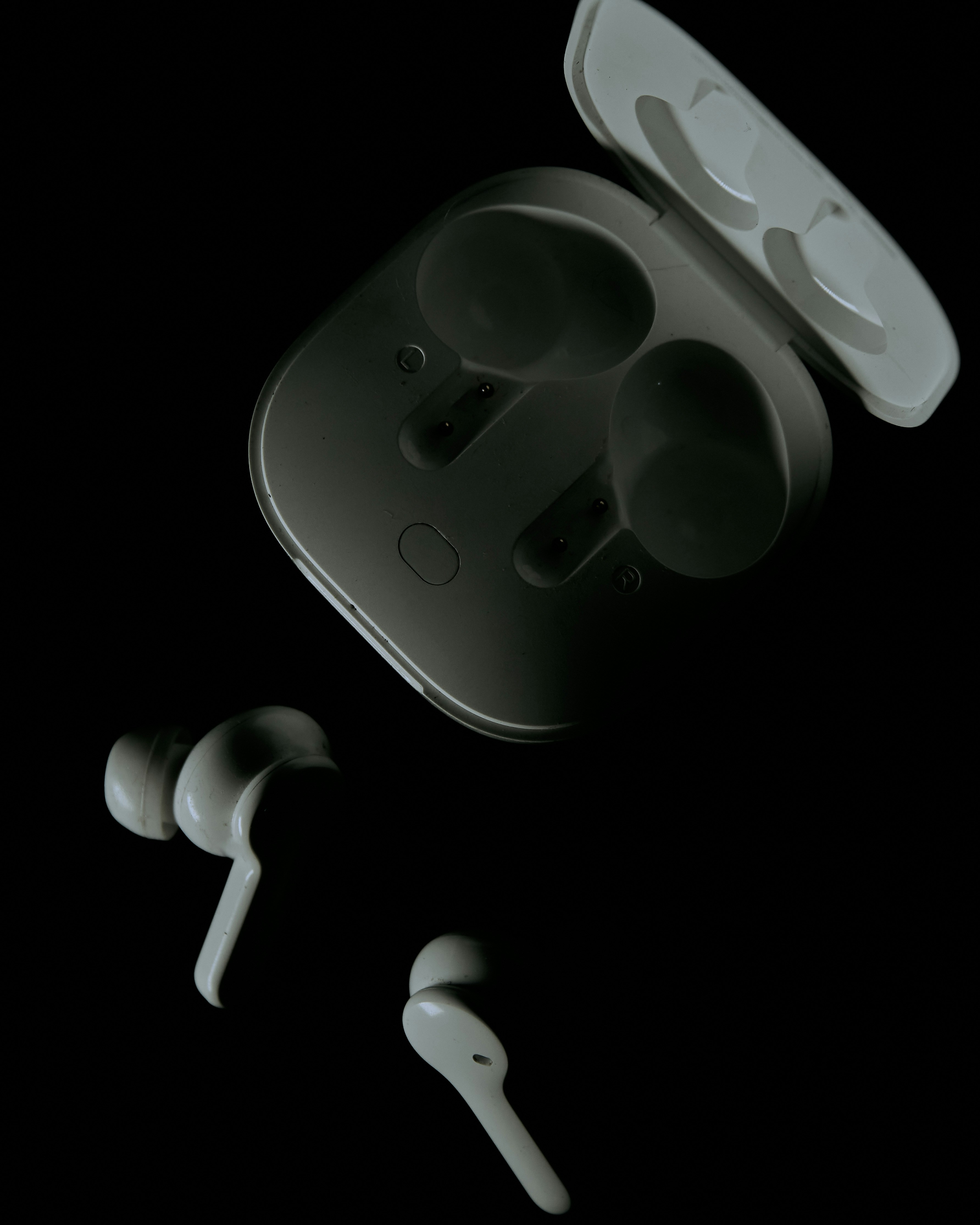Wireless earbuds white background bright studio