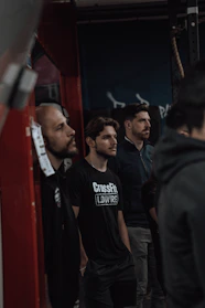 Urban gym scene with athletes wearing streetwear fitness apparel.