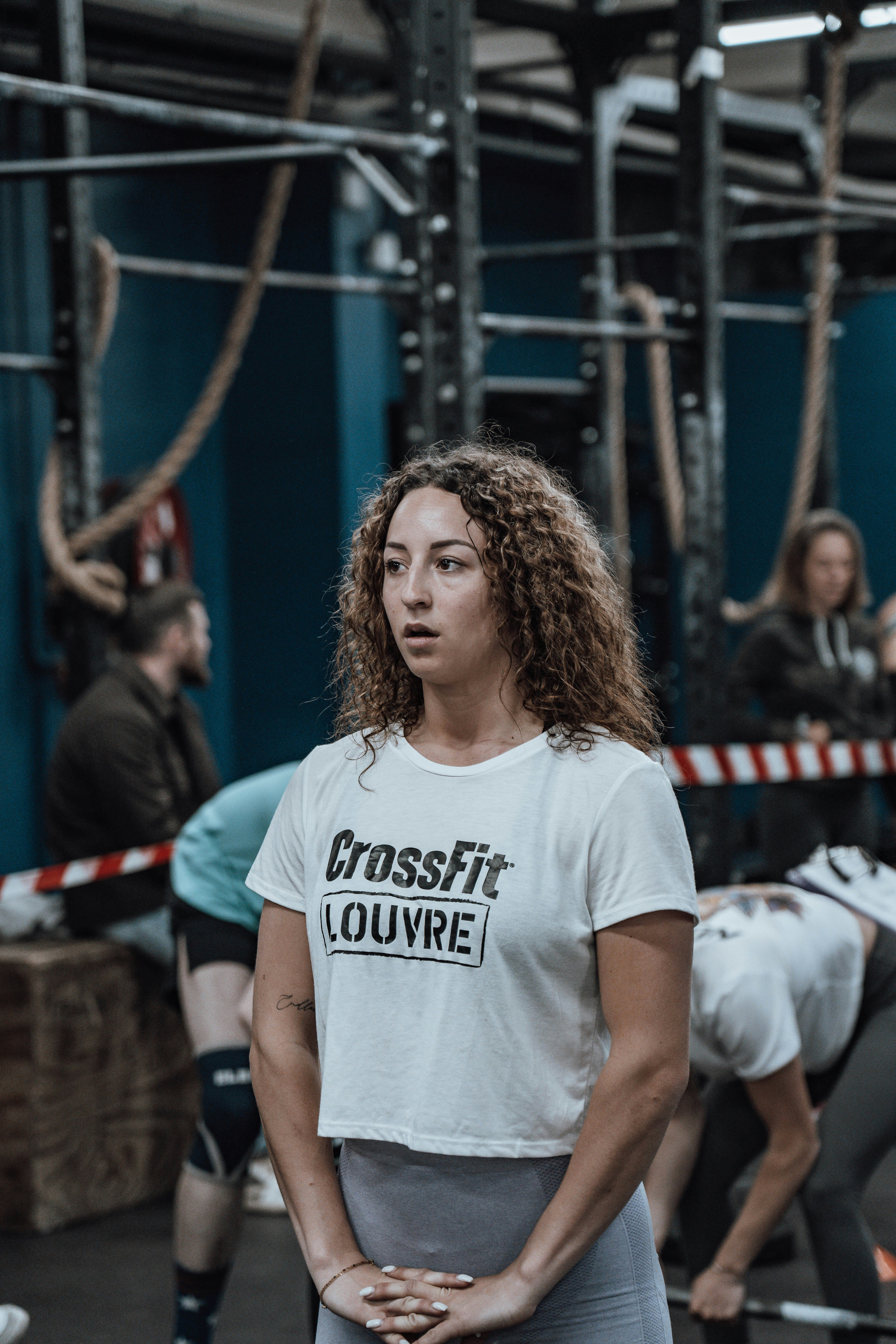 a woman standing in front of a group of people