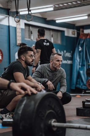 a group of men working out in a gym