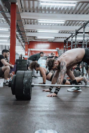 a group of men working out in a gym