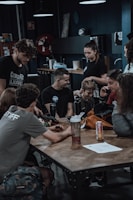 A lively group of influencers tasting and discussing health products at a local event.