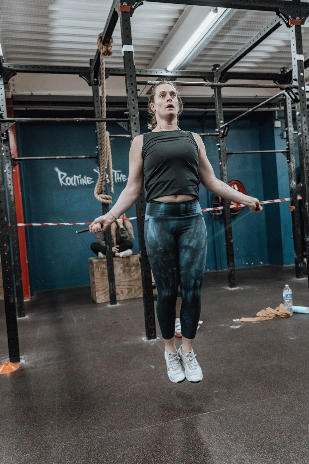 a woman standing in a crossfit gym