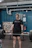 Photo of a focused gym member lifting weights inside a military-style training gym.