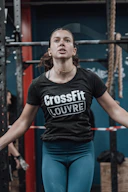 a woman standing in a crossfit gym