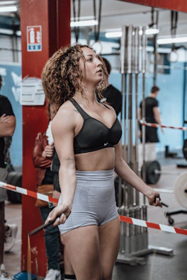 Instructor demonstrating rhythm and coordination moves with a jump rope.