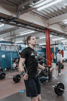 An instructor demonstrating advanced jump rope techniques in a bright studio.