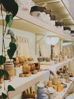 A cozy display of colorful home decor items arranged on wooden shelves.