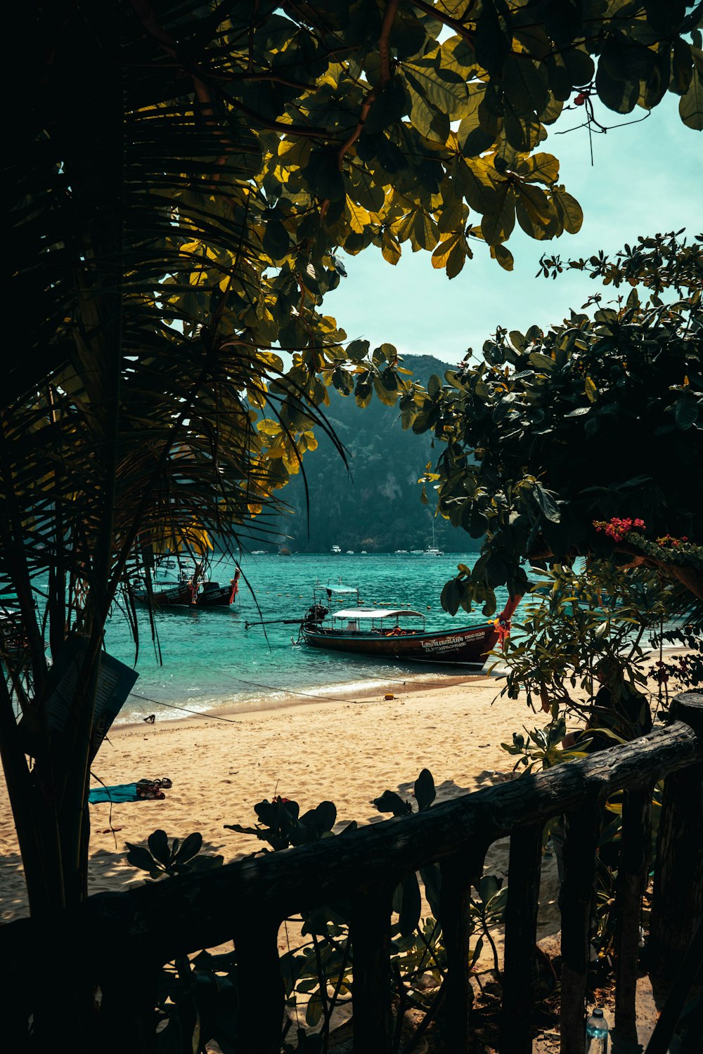 a view of a beach with boats in the water