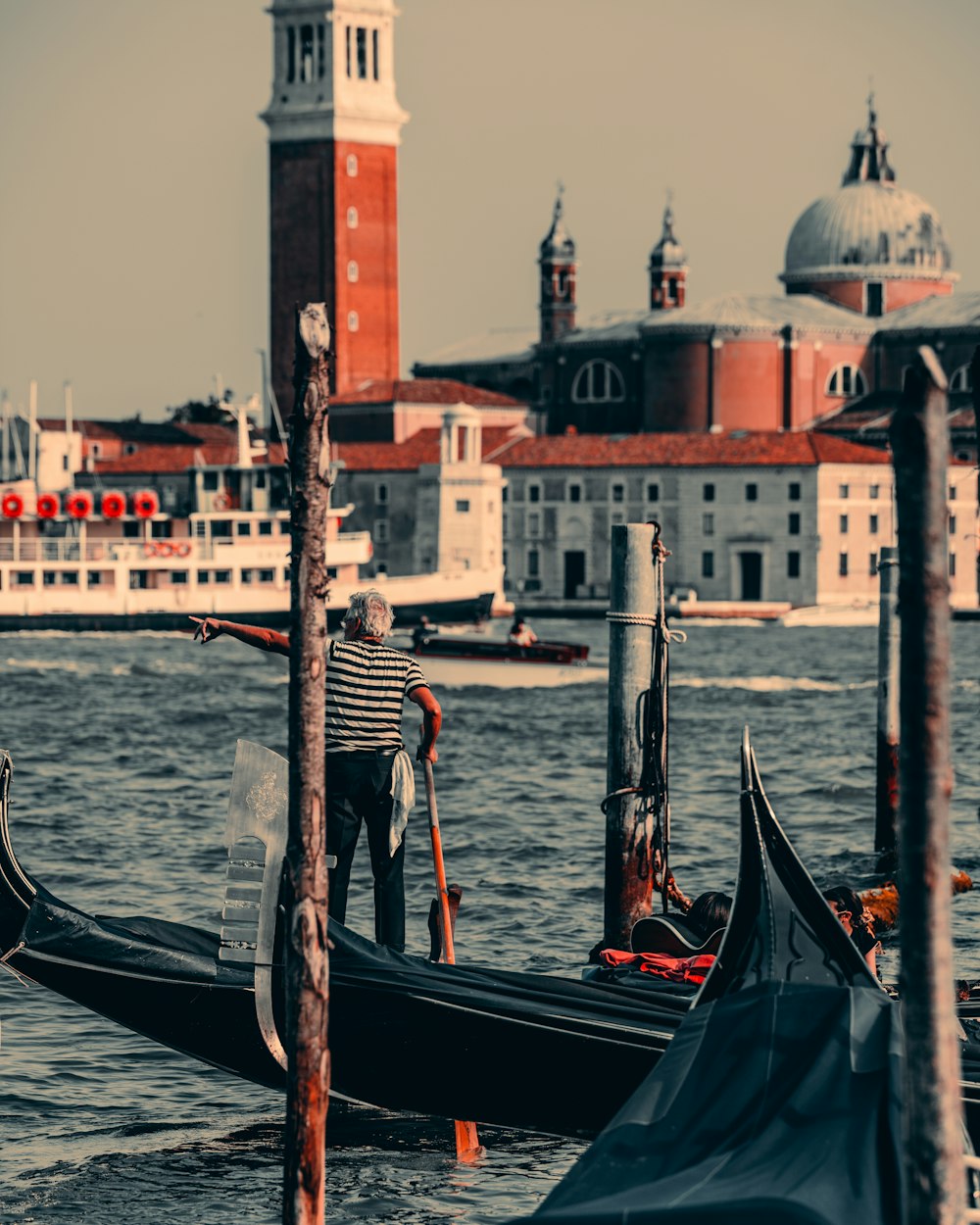 a couple of gondolas that are sitting in the water