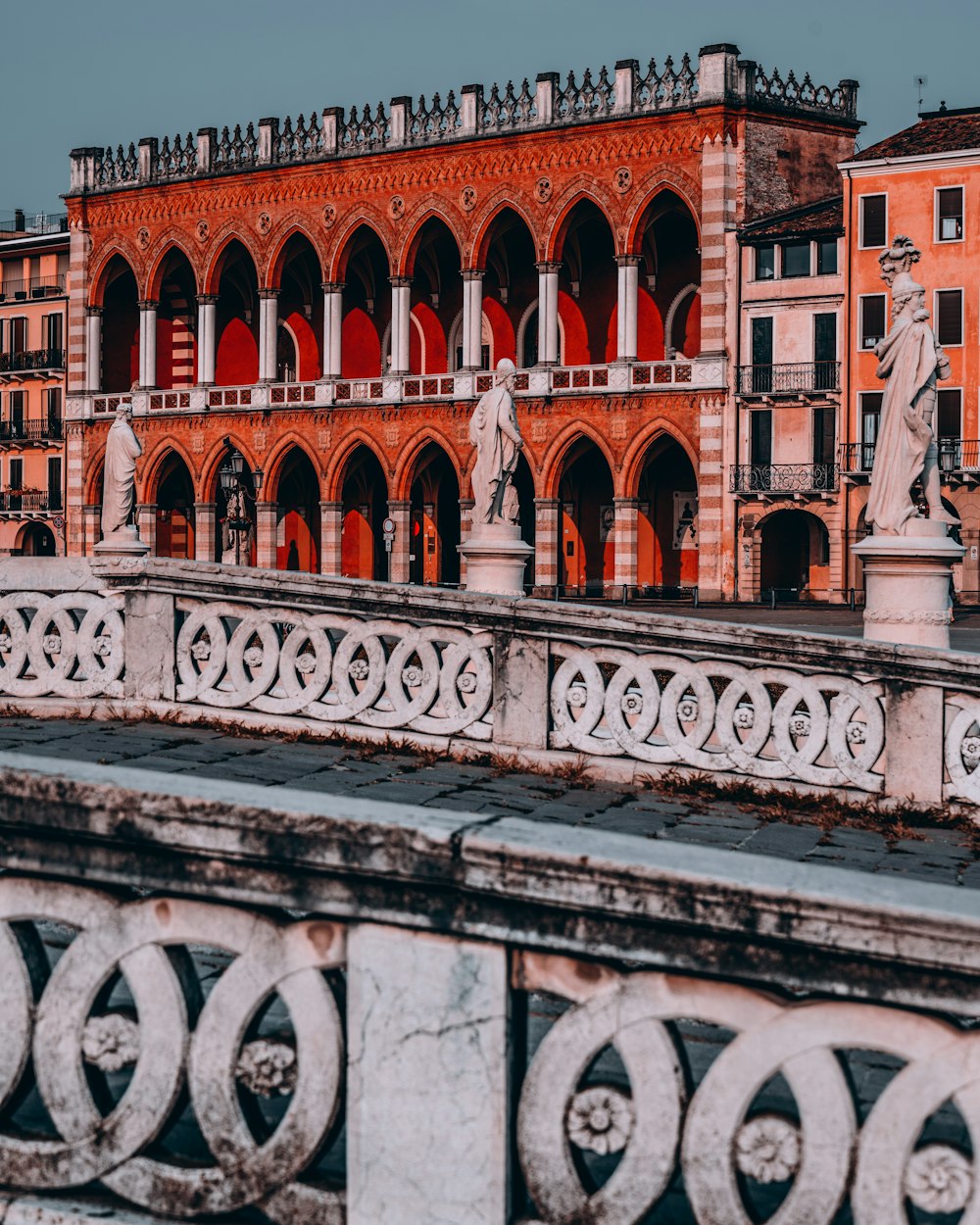 a bridge with a building in the background