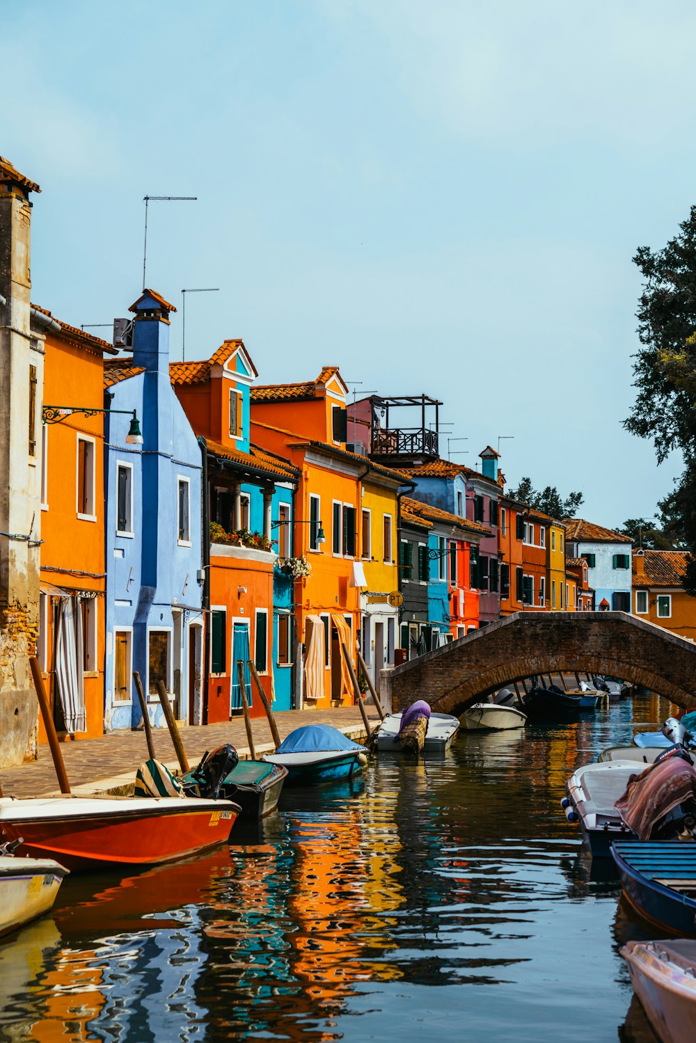 a bridge over a body of water next to a row of houses