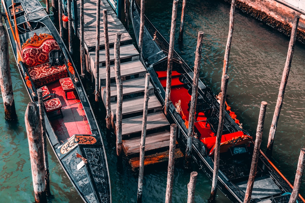 a boat is docked in the water next to a dock