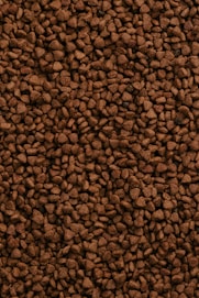a close up of a pile of brown rocks