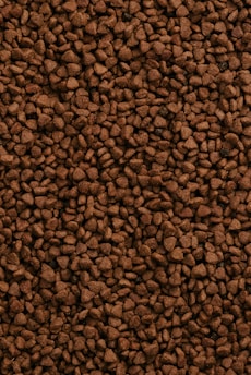 a close up of a pile of brown rocks