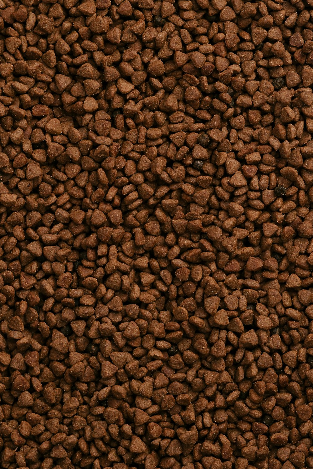 a close up of a pile of brown rocks