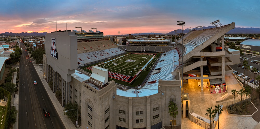 an aerial view of a football stadium at sunset