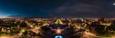 A panoramic view of Medellín’s trendy district at night, alive with vibrant colors and subtle movement.