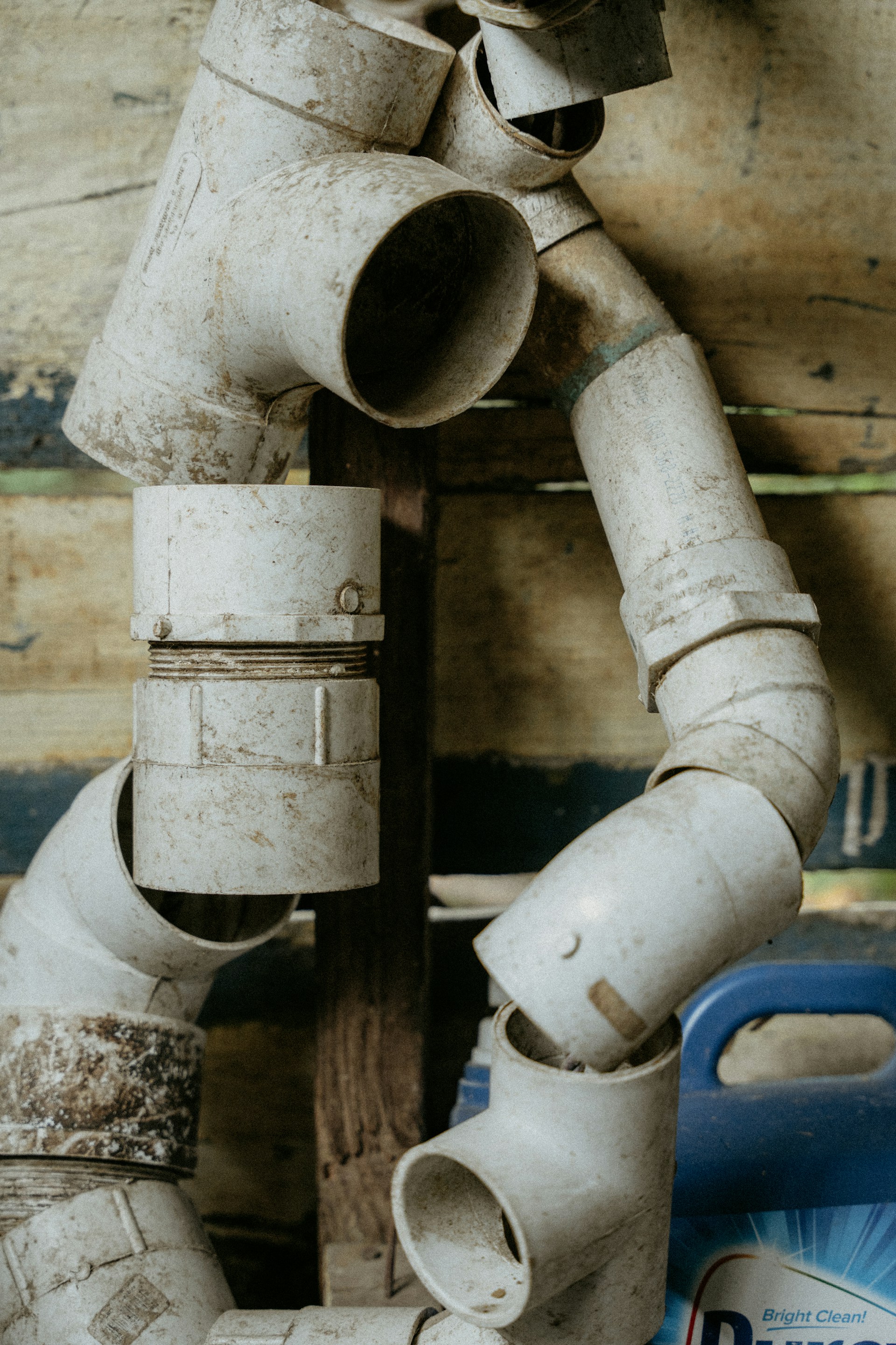 a close up of pipes and fittings on a wall