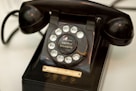 an old fashioned telephone sitting on a table