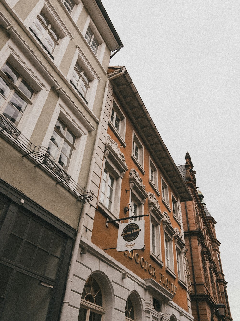 a tall building with a clock on the side of it