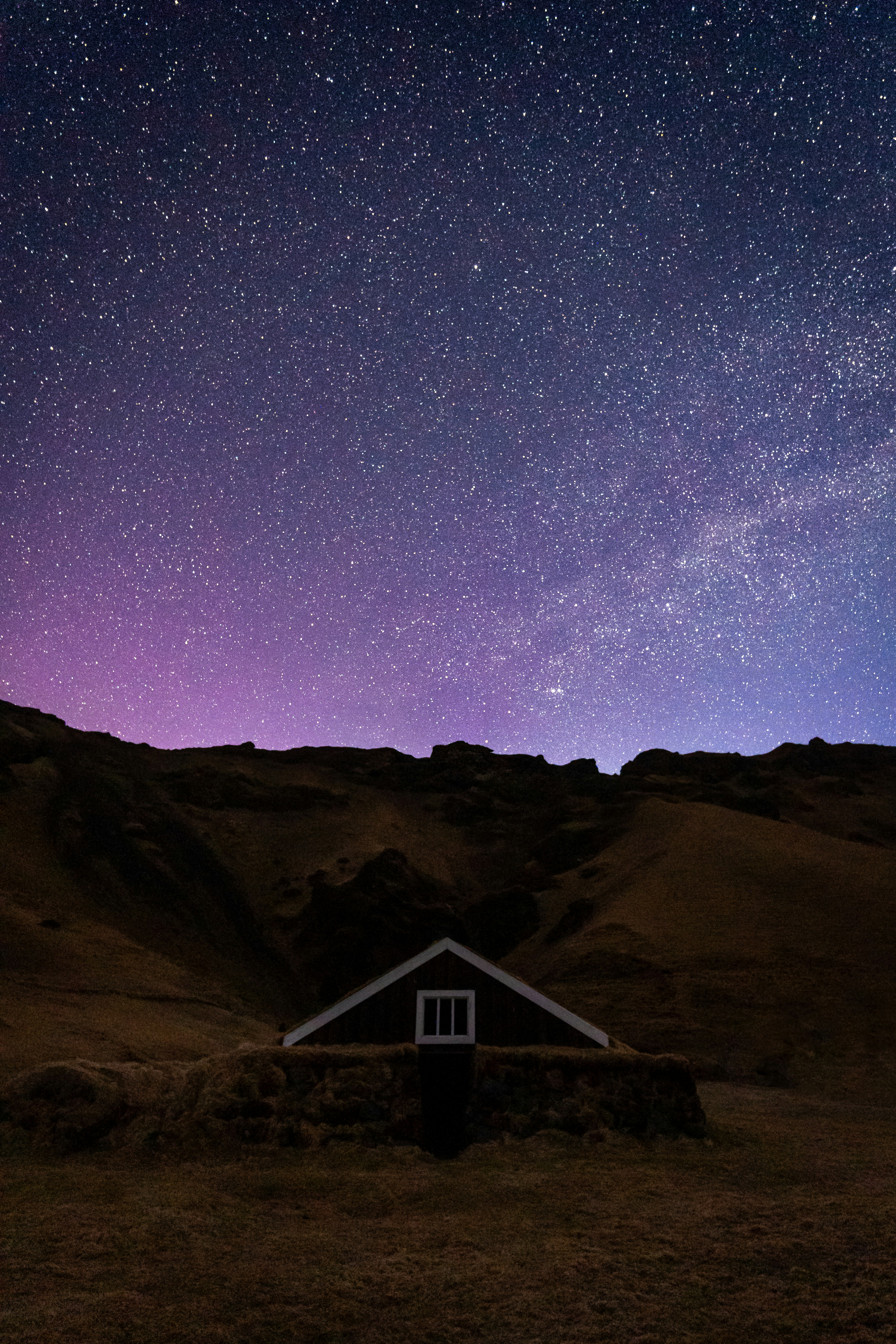 The night sky with stars above a small house photo – Free Iceland Image ...