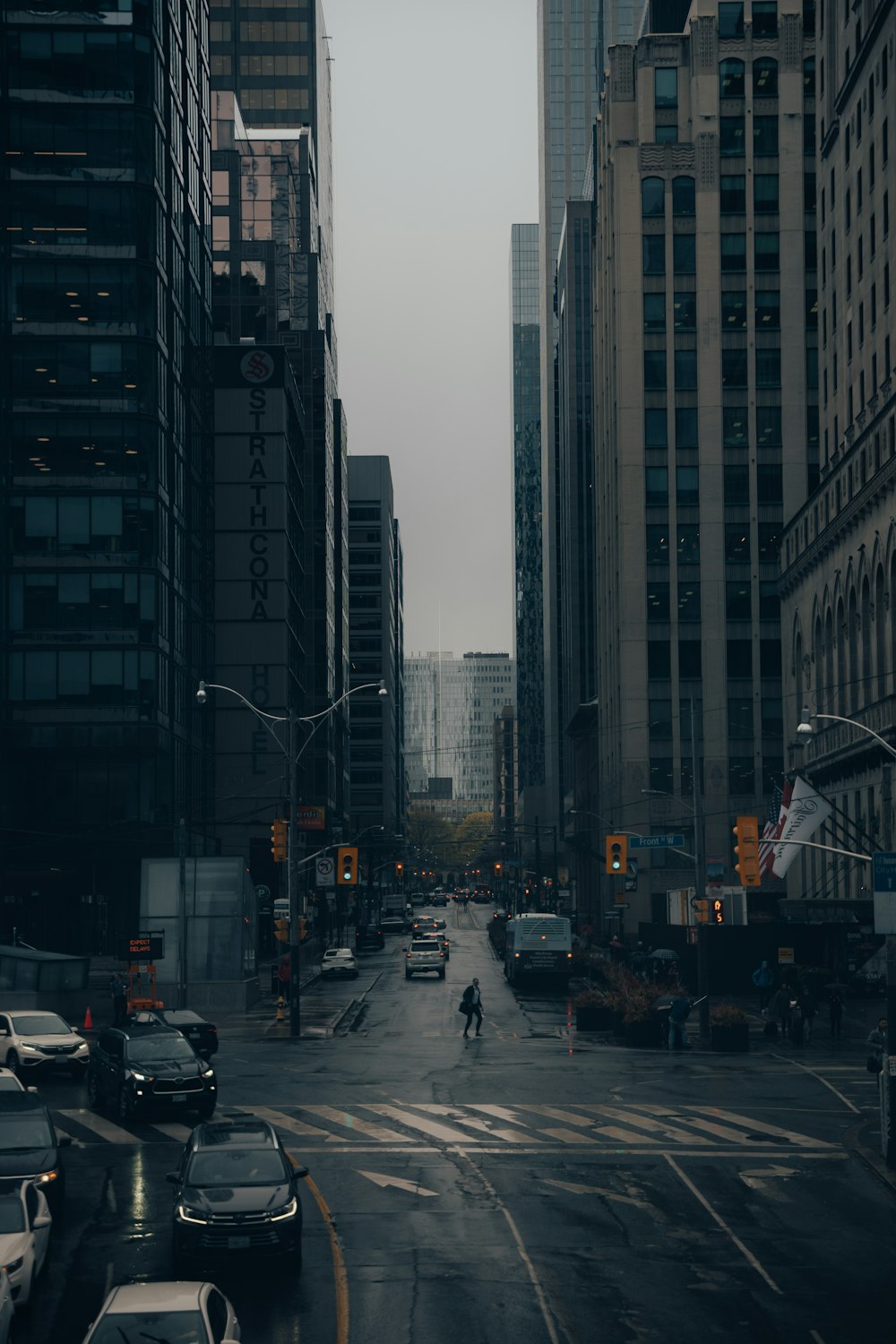 a city street filled with lots of tall buildings