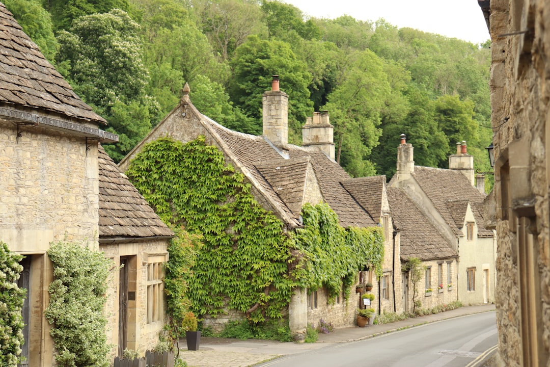 Stone cottages and the Old Tea Room in the Cotswolds Village of Castle Combe, North Wiltshire, UK –  Photo by Joshua Smith | Castle Combe England