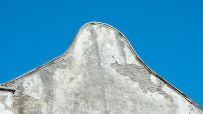 Restored exterior wall showing clean, vibrant paint and repaired surfaces.