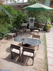 Modern air conditioning units installed in a cozy outdoor seating area