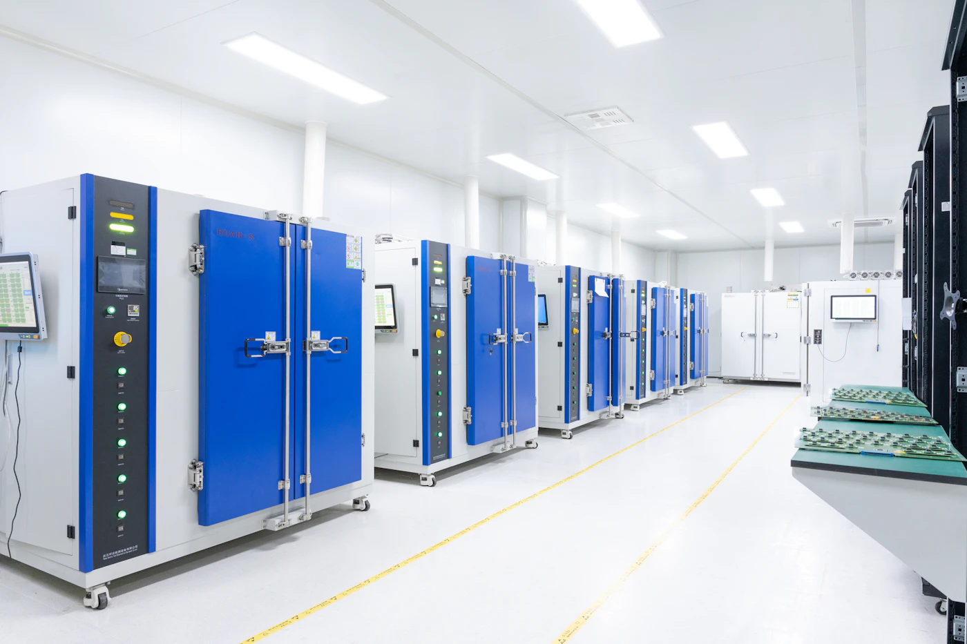 Rows of blue and white server racks in a clean data center aisle