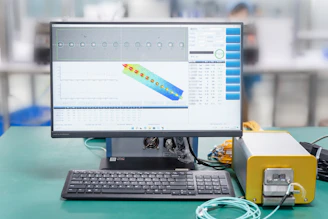 a computer monitor sitting on top of a desk