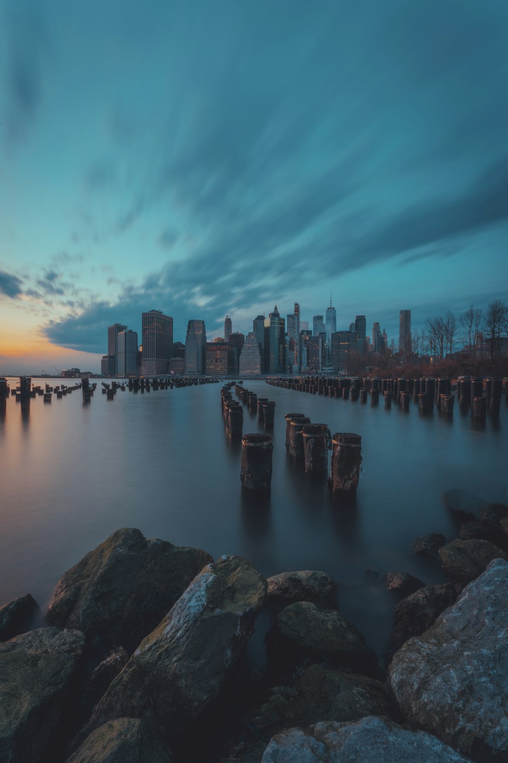 a view of a city from the shore of a body of water