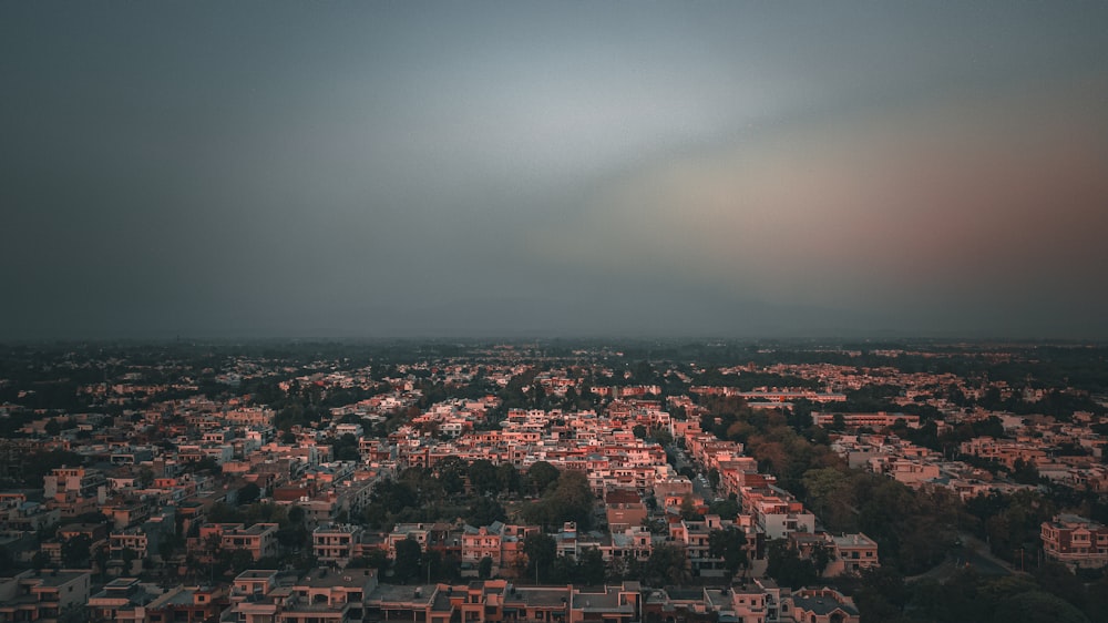 an aerial view of a city at dusk