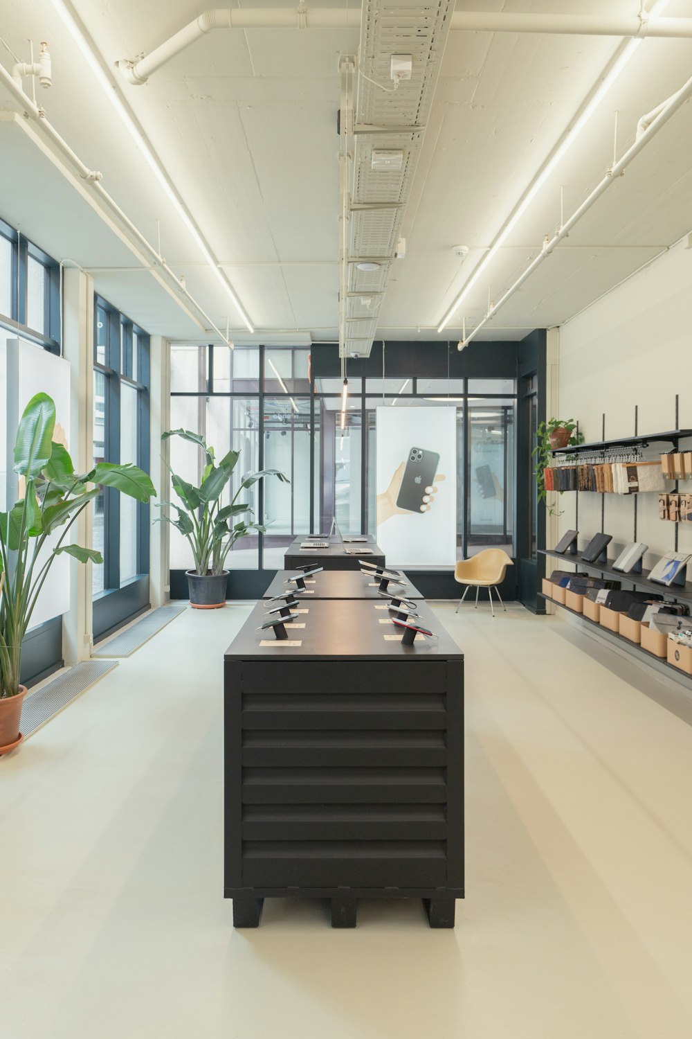 a long table in a room with a lot of shelves