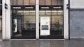 A storefront with large glass windows and multiple signs displaying 'revendo'. Inside, there are visible chairs, plants, and shelves. A poster on the window features the words 'Sell. Repair. Buy.' along with an image of a hand interacting with an electronic device.