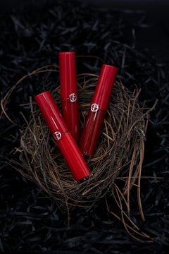 Photo of a limited edition lipstick set displayed with elegant floral accents.