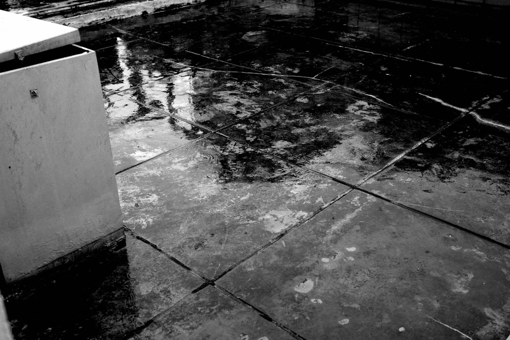 a black and white photo of a wet floor