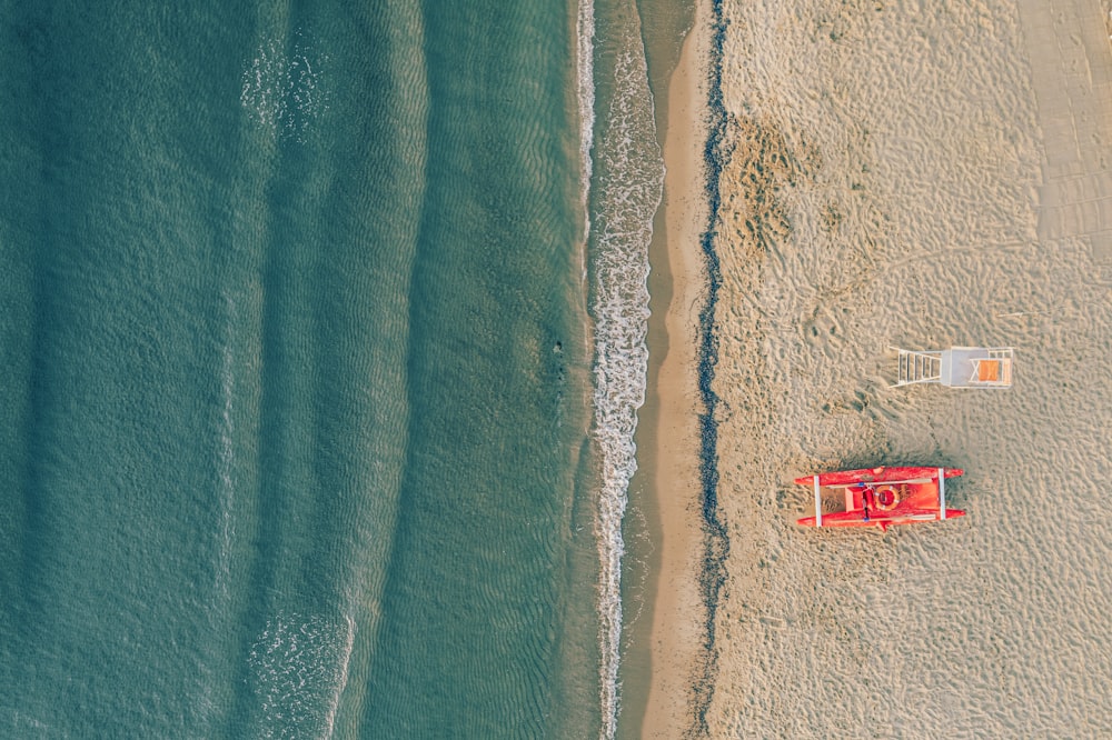 an aerial view of a beach with a lifeguard tower