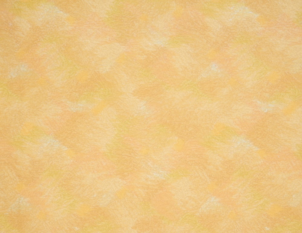 an orange and yellow background with small white dots