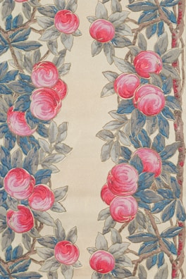 A detailed pattern of red peaches and blue-green leaves arranged in a symmetrical design. The peaches are depicted in various shades of red and pink, while the leaves have a mix of blue and gray tones. The background is a light, beige color.