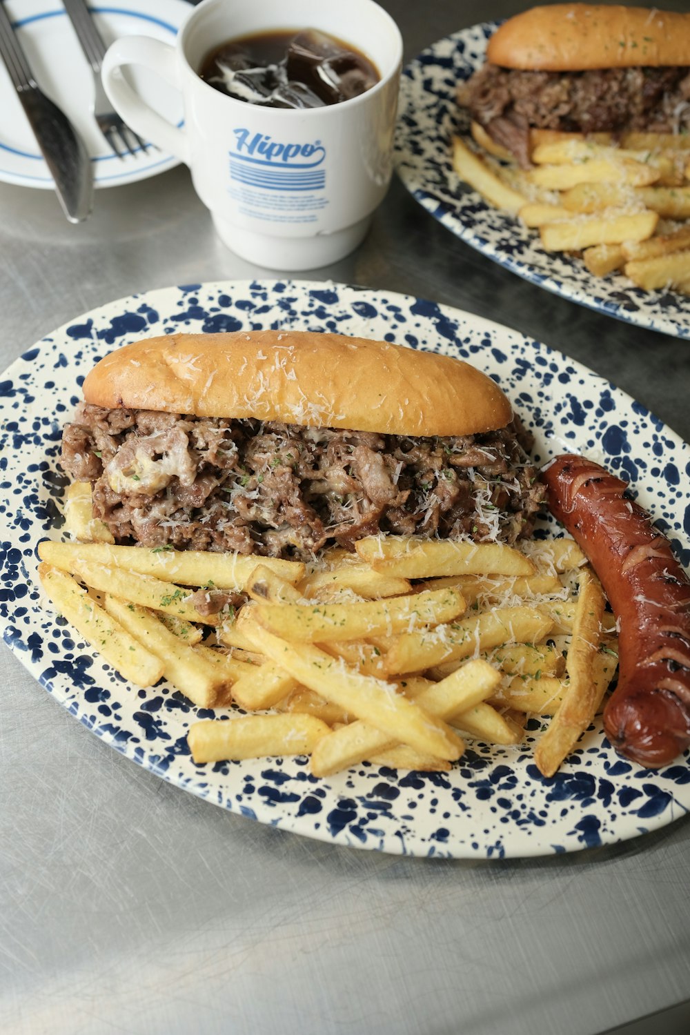 a plate with a hamburger and french fries on it