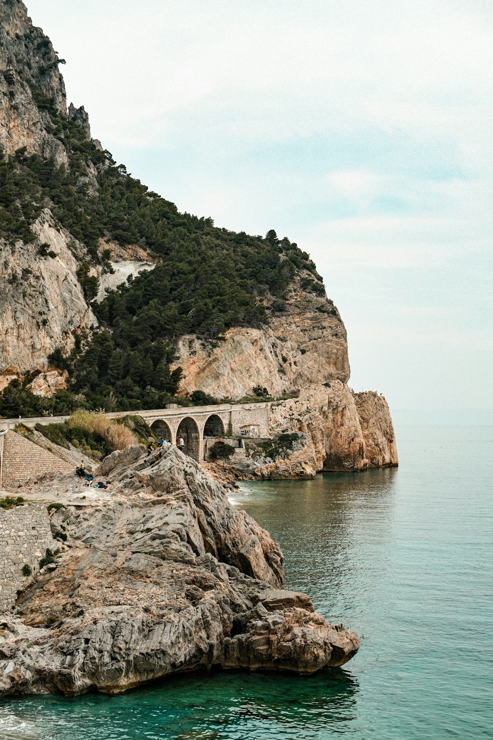 a large body of water with a bridge on top of it