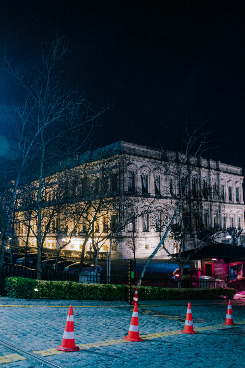 a large building with a clock tower at night